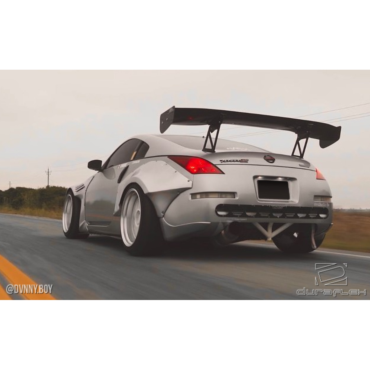 Modify your Nissan 350Z 2003 with our Exterior/Fenders - The image shows the car from a rear angle