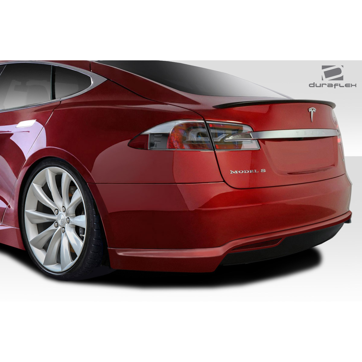 Modify your Tesla S 2012 with our Exterior/Complete Body Kits - The part is viewed at a rear three-quarters angle