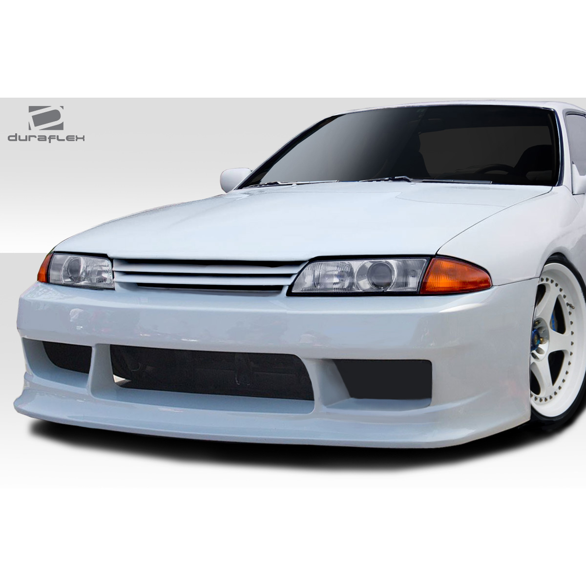 Modify your Nissan Skyline 1989 with our Exterior/Complete Body Kits - Frontal view of the bumper with slight angle