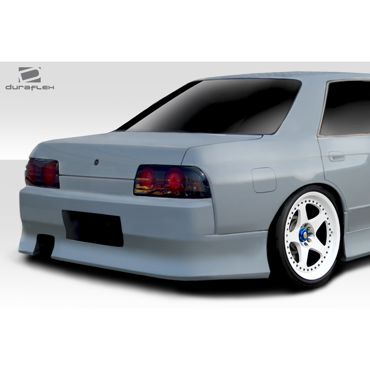 Modify your Nissan Skyline 1989 with our Exterior/Rear Bumpers or Lips - Rear angle view of the vehicle part