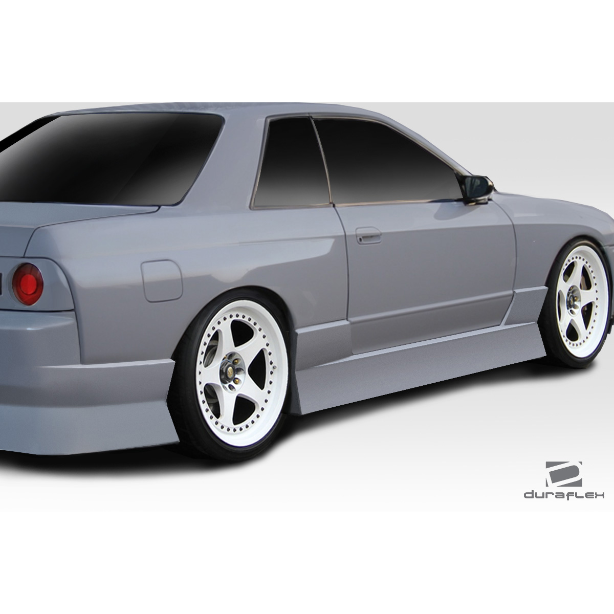 Modify your Nissan Skyline 1989 with our Exterior/Side Skirts - Side view of the vehicle at a high angle