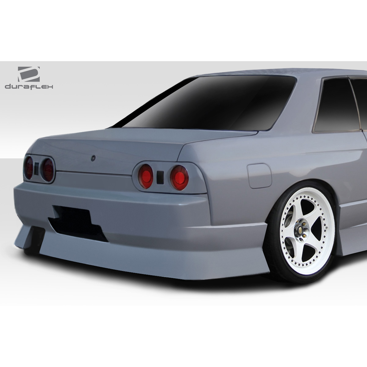 Modify your Nissan Skyline 1989 with our Exterior/Complete Body Kits - Rear angle view of Nissan Skyline R32 shown