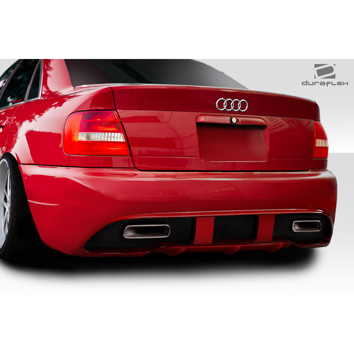 Modify your Audi A4 1996 with our Exterior/Rear Bumpers or Lips - Rear angle view of Audi A4 near ground