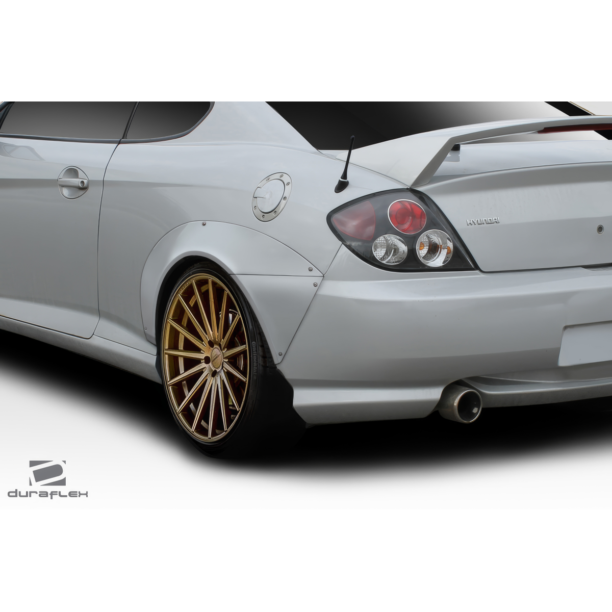 Modify your Hyundai Tiburon 2003 with our Exterior/Fenders - Angle shows the rear side of the vehicle