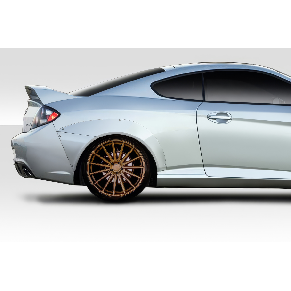 Modify your Hyundai Tiburon 2003 with our Exterior/Fenders - Side angle view of rear fender flares