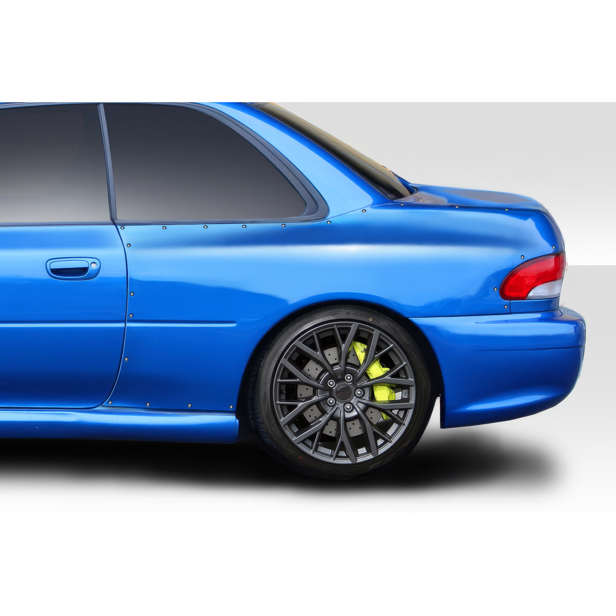 Modify your Subaru Impreza 1993 with our Exterior/Fenders - Side angle view of blue Subaru Impreza