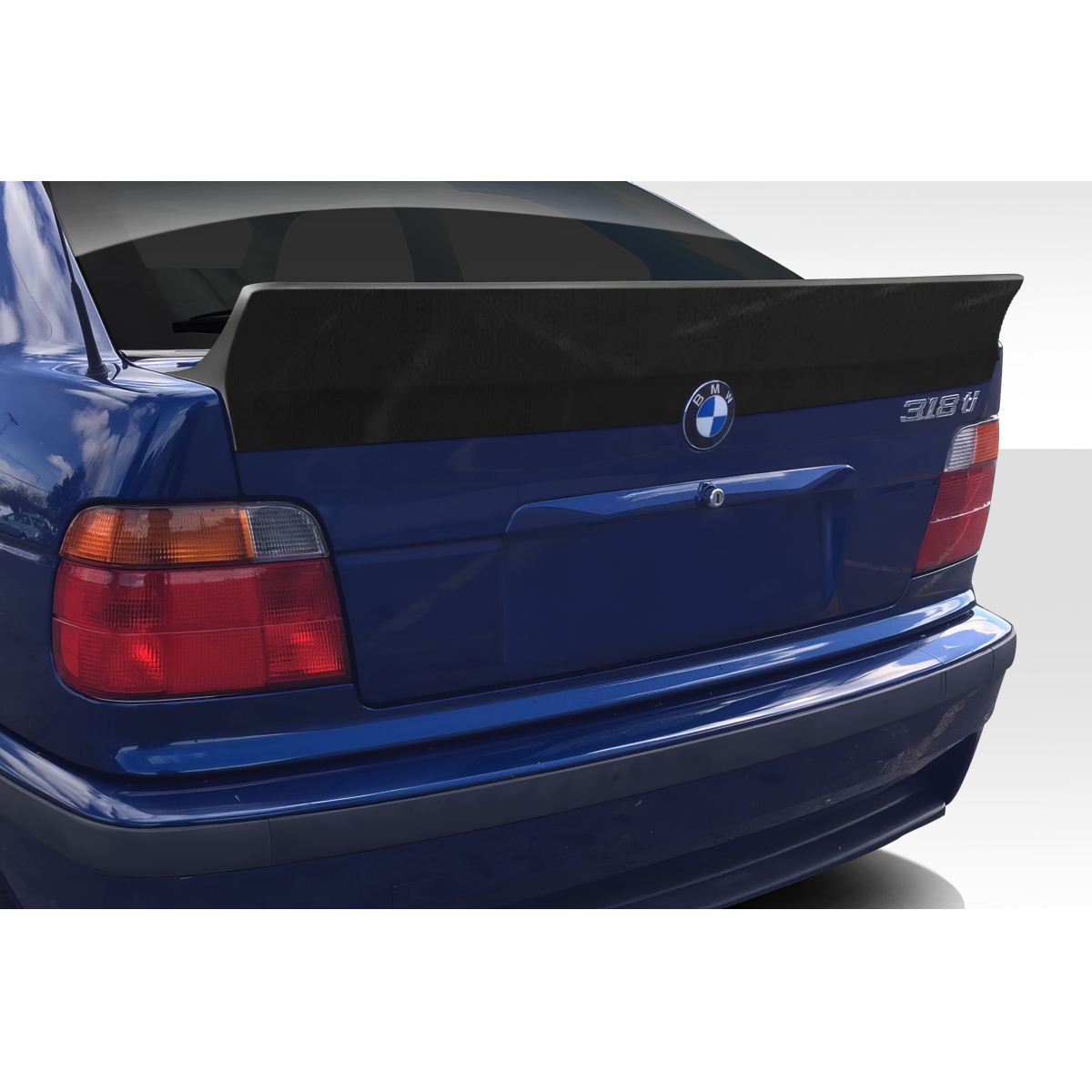 Modify your BMW 3-Series 1992 with our Exterior/Wings - Rear angle view of the wing spoiler on car