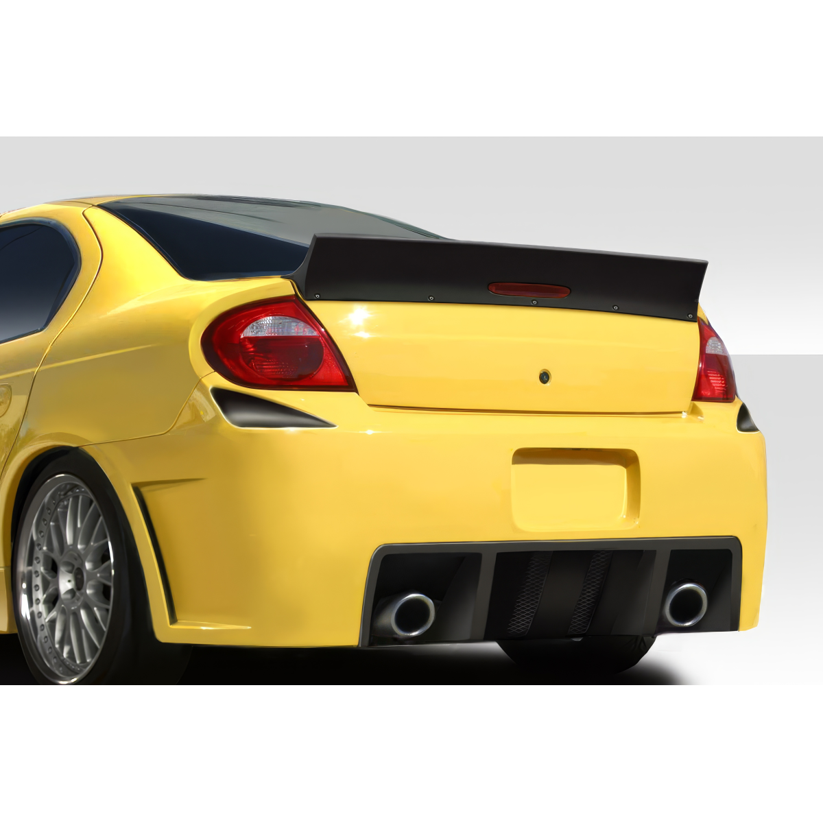 Modify your Dodge Neon 2000 with our Exterior/Wings - Rear angle of a yellow Dodge Neon vehicle