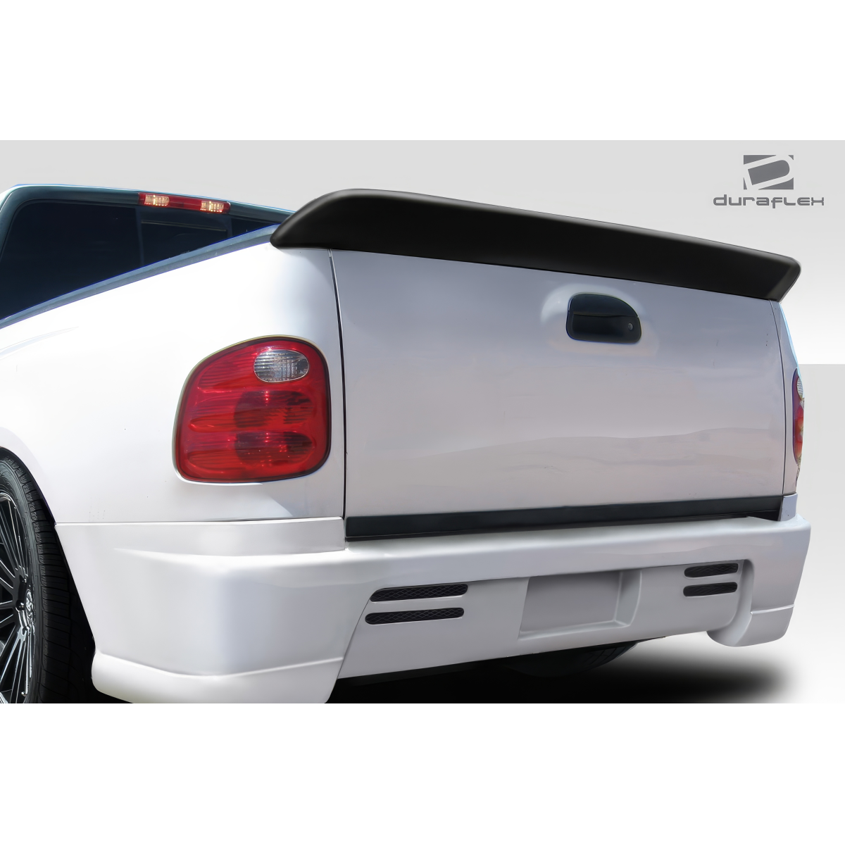 Modify your Ford F-150 1997 with our Exterior/Wings - Rear view of truck tailgate at a slight angle