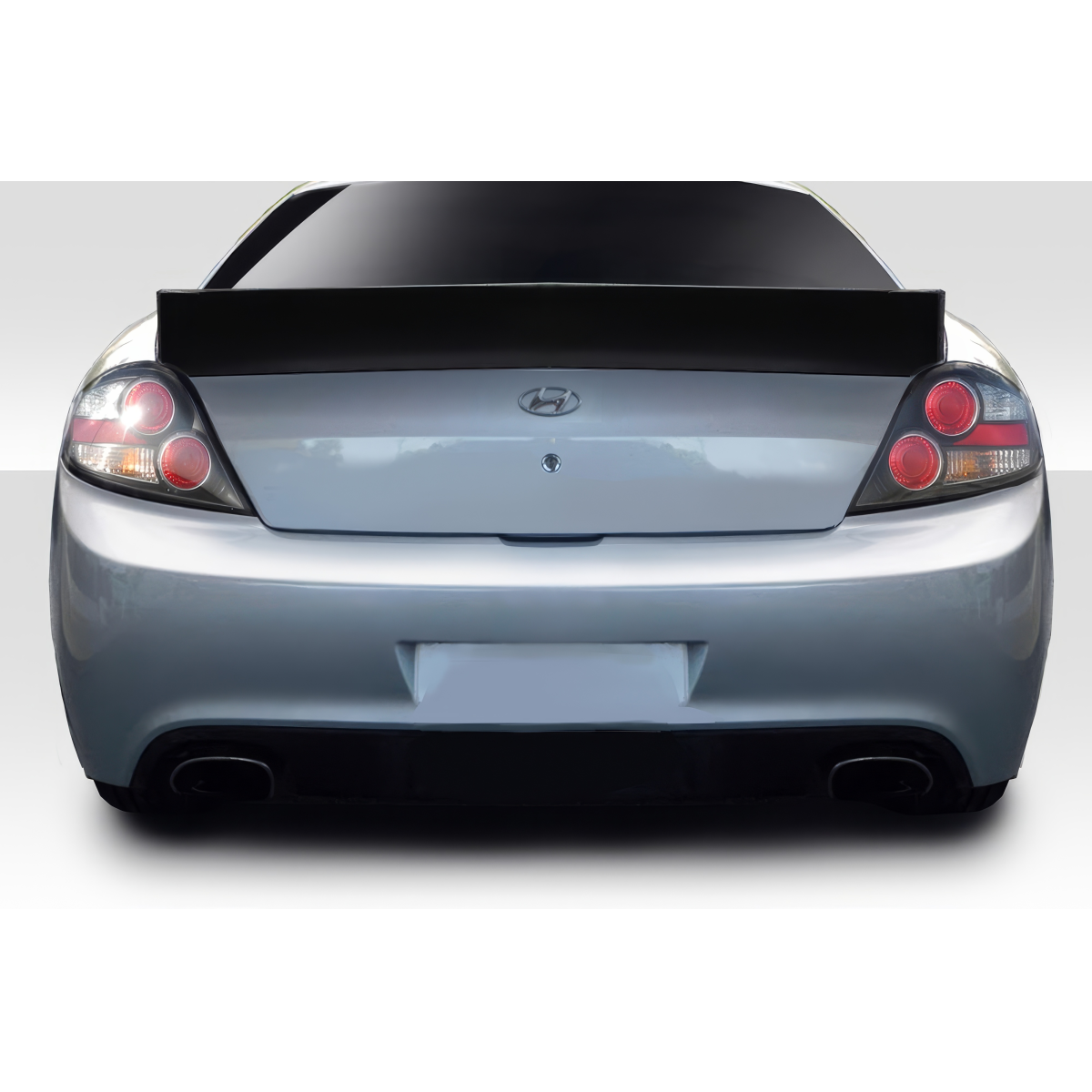 Modify your Hyundai Tiburon 2003 with our Exterior/Wings - Rear view angle of a Hyundai Tiburon