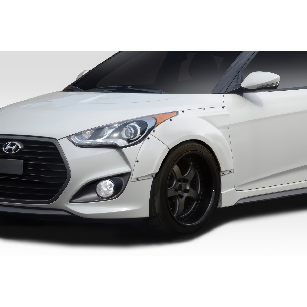 Modify your Hyundai Veloster 2012 with our Exterior/Fenders - Front angle view of fender flares on vehicle