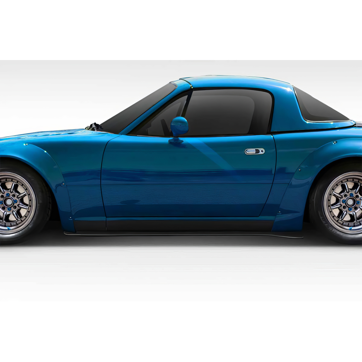 Modify your Mazda Miata 1990 with our Exterior/Other Exterior - Side view of a Mazda Miata at profile angle