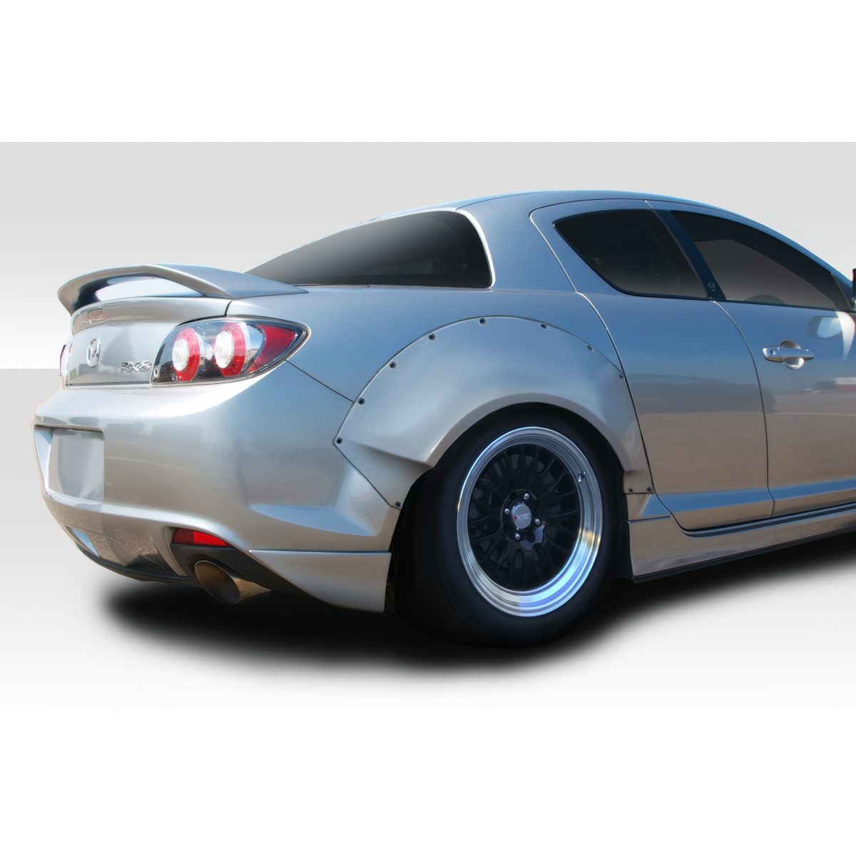 Modify your Mazda RX-8 2004 with our Exterior/Fenders - Rear angle showing Mazda RX-8 with fender flares