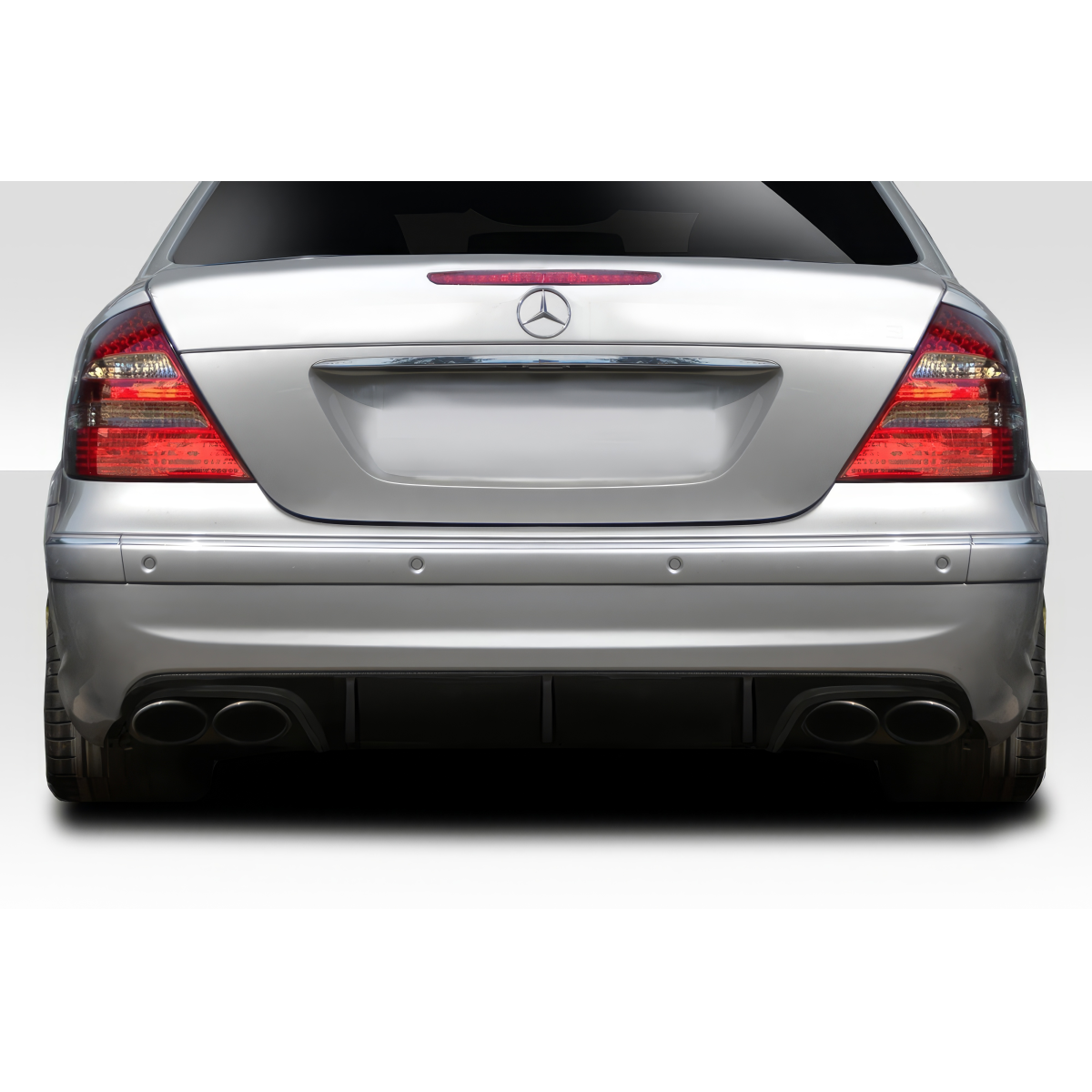 Modify your Mercedes-Benz E55 AMG 2003 with our Exterior/Diffusers - Rear angle of a car focused on the diffuser