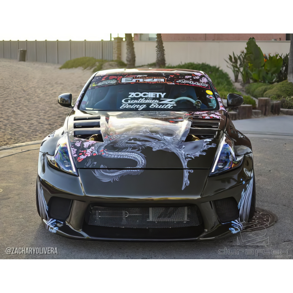 Modify your Nissan 370Z 2009 with our Exterior/Hoods - Front angle view of the vehicle showcasing the hood