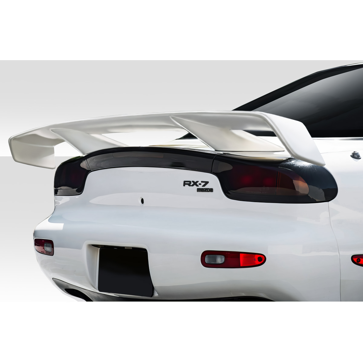 Modify your Mazda RX-7 1993 with our Exterior/Wings - Rear view angle showcasing wing and tail lights