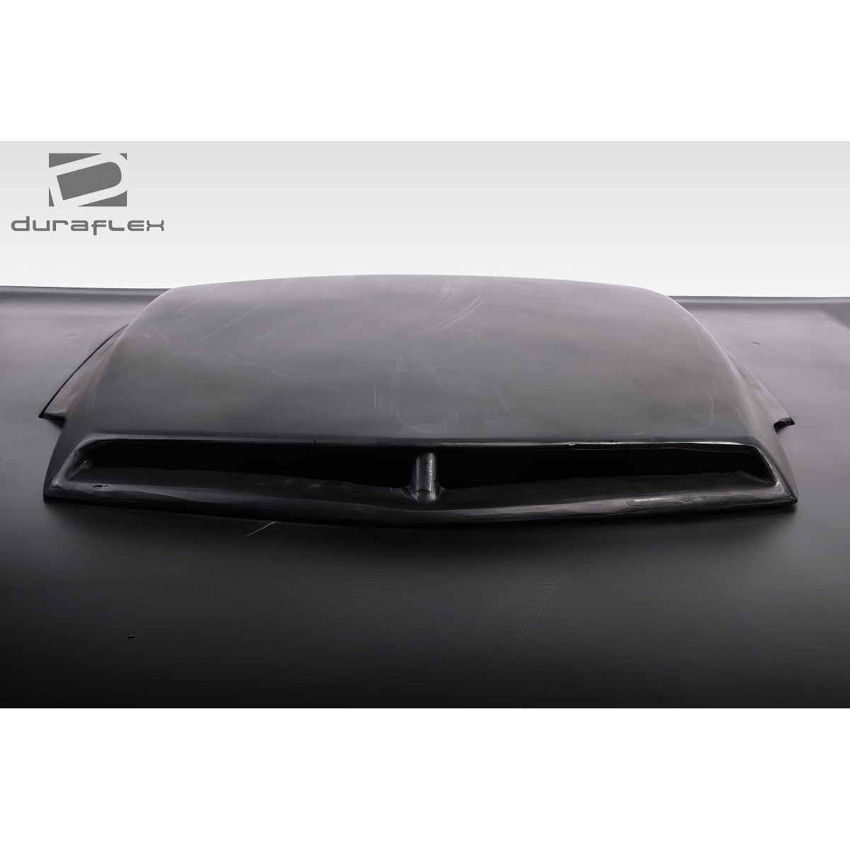 Modify your Dodge Challenger 2008 with our Exterior/Hoods - Front view of a car hood at a slight angle