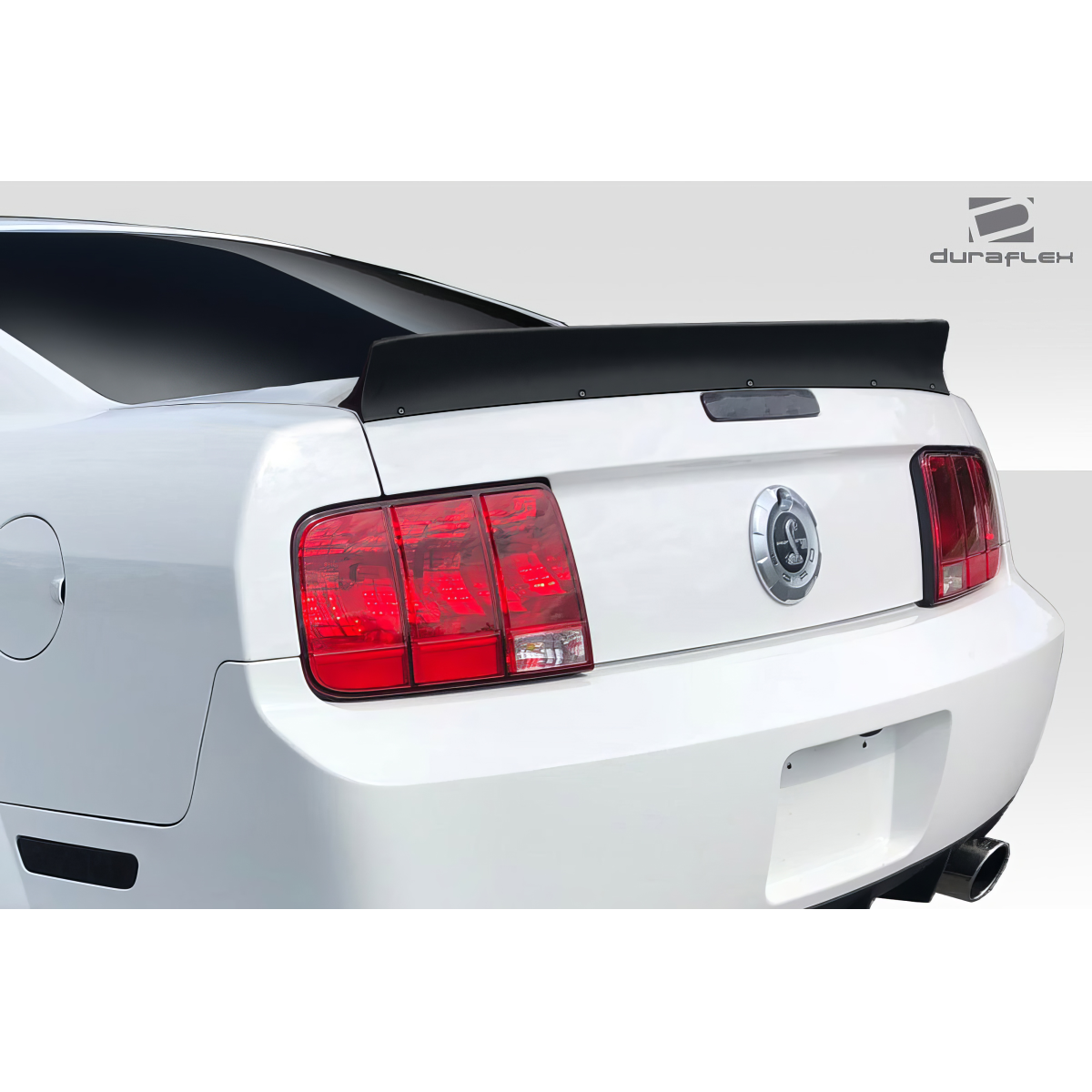 Modify your Ford Mustang 2005 with our Exterior/Wings - Rear angle view of a Mustang wing installed