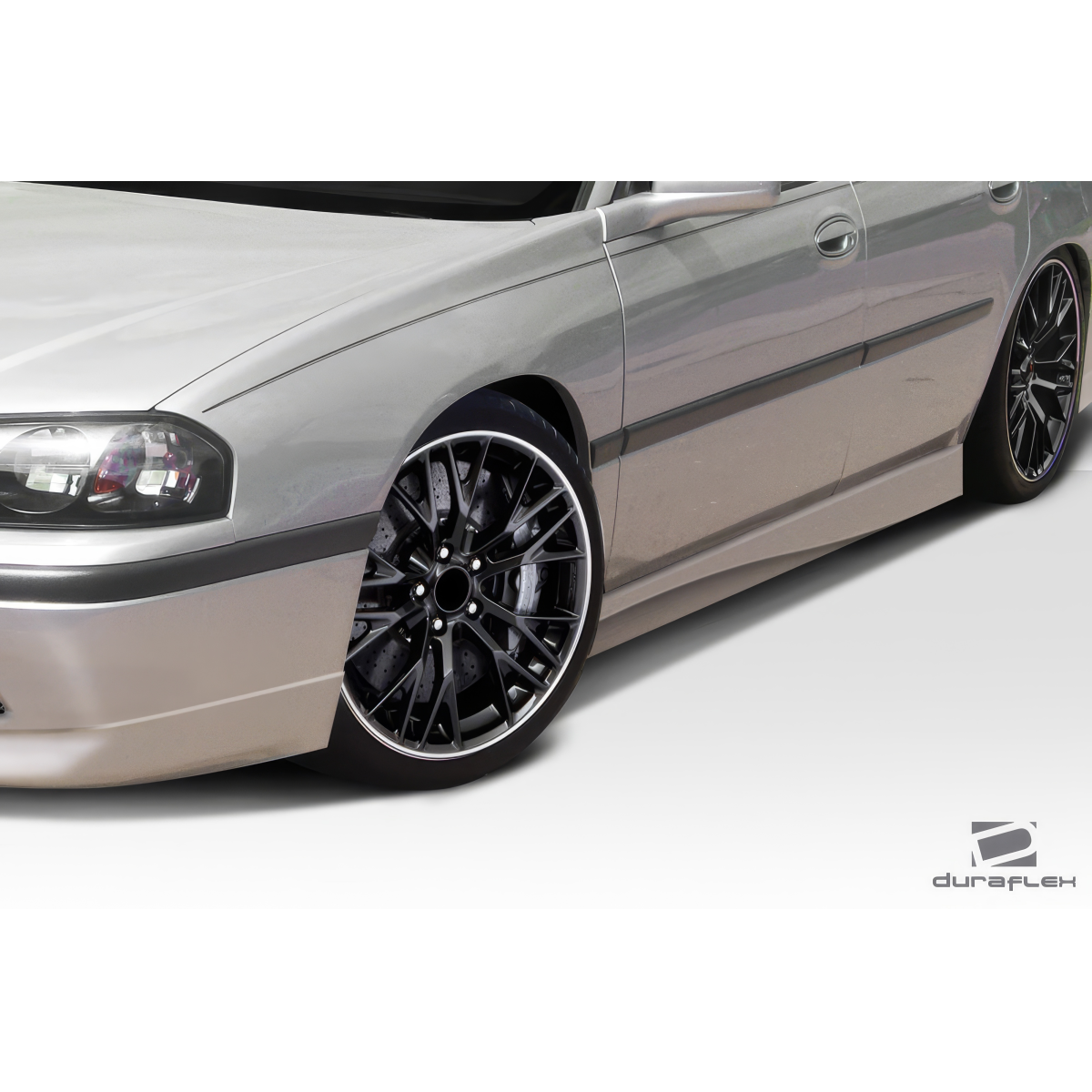 Modify your Chevrolet Impala 2000 with our Exterior/Side Skirts - Angled view of the side skirt and wheel