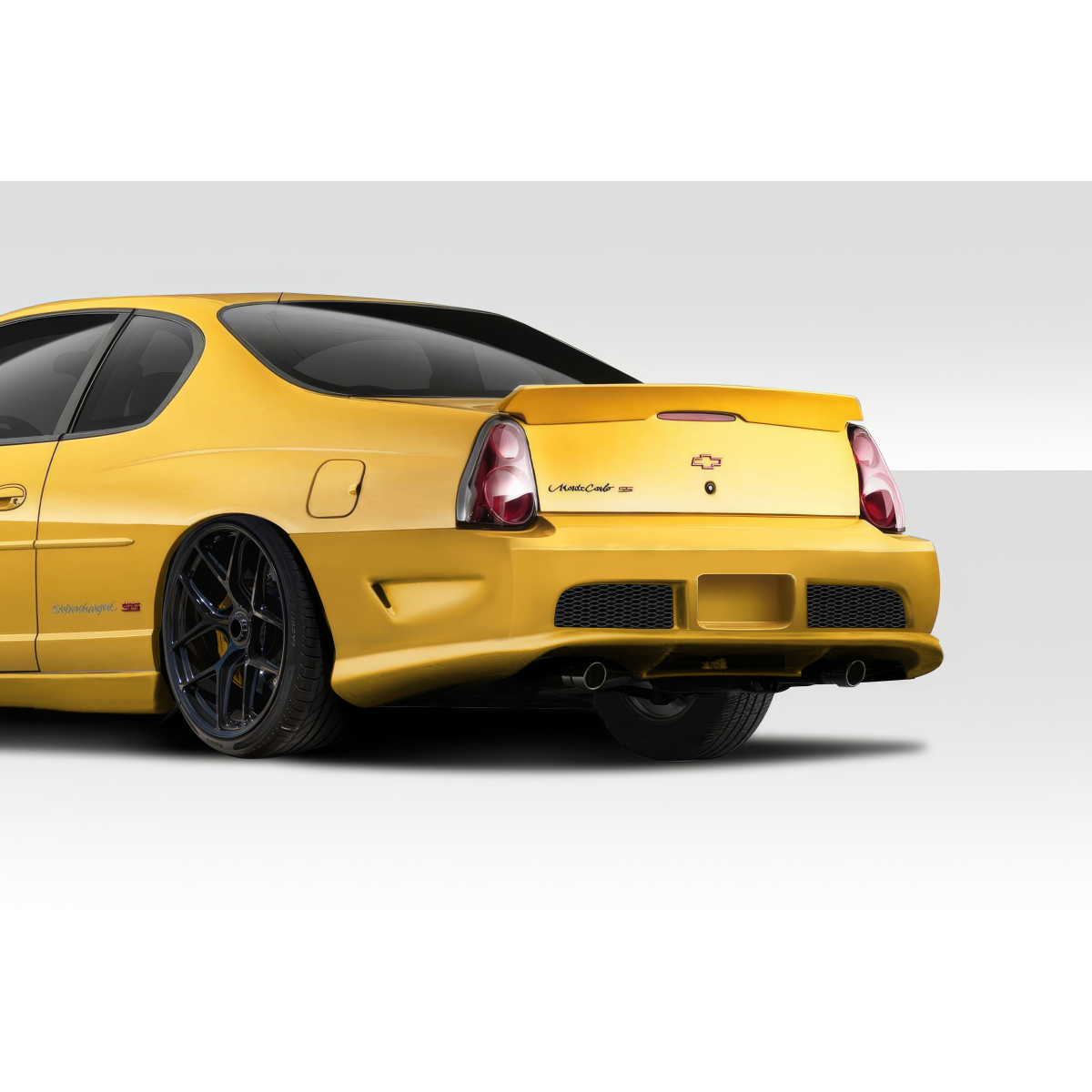 Modify your Chevrolet Monte Carlo 2000 with our Exterior/Rear Bumpers or Lips - Angle from the rear side view of the vehicle