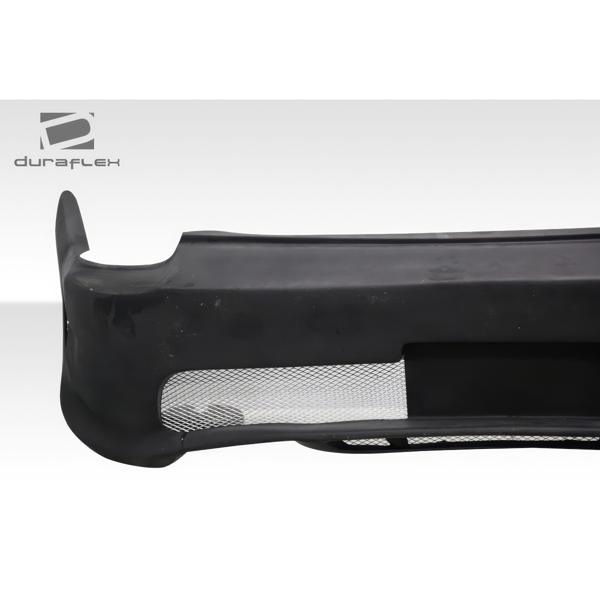 Modify your Chevrolet Monte Carlo 2000 with our Exterior/Rear Bumpers or Lips - Angled view of rear bumper with mesh opening