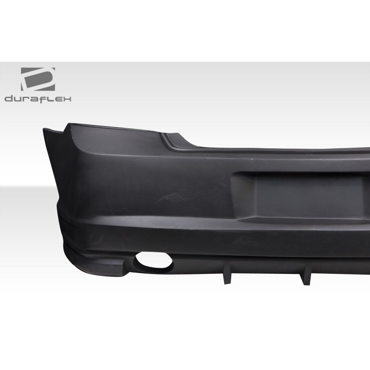 Modify your Dodge Charger 2006 with our Exterior/Rear Bumpers or Lips - Image shows the rear bumper from a side angle