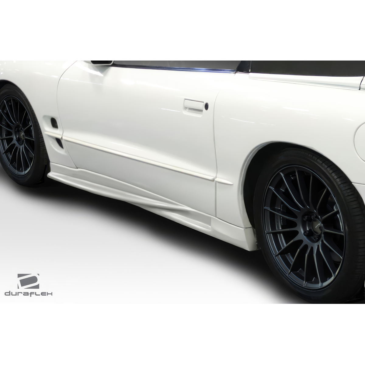 Modify your Pontiac Firebird 1998 with our Exterior/Complete Body Kits - Side view of the car part from a low angle