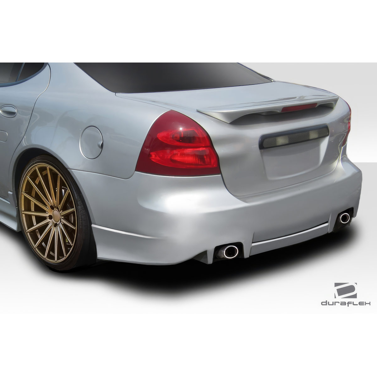 Modify your Pontiac Grand Prix 2004 with our Exterior/Rear Bumpers or Lips - Rear angle view of the vehicle showing the bumper