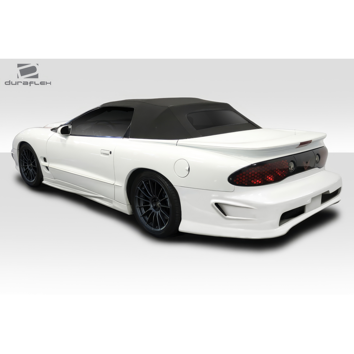 Modify your Pontiac Firebird 1998 with our Exterior/Complete Body Kits - Rear three quarter view of the vehicle