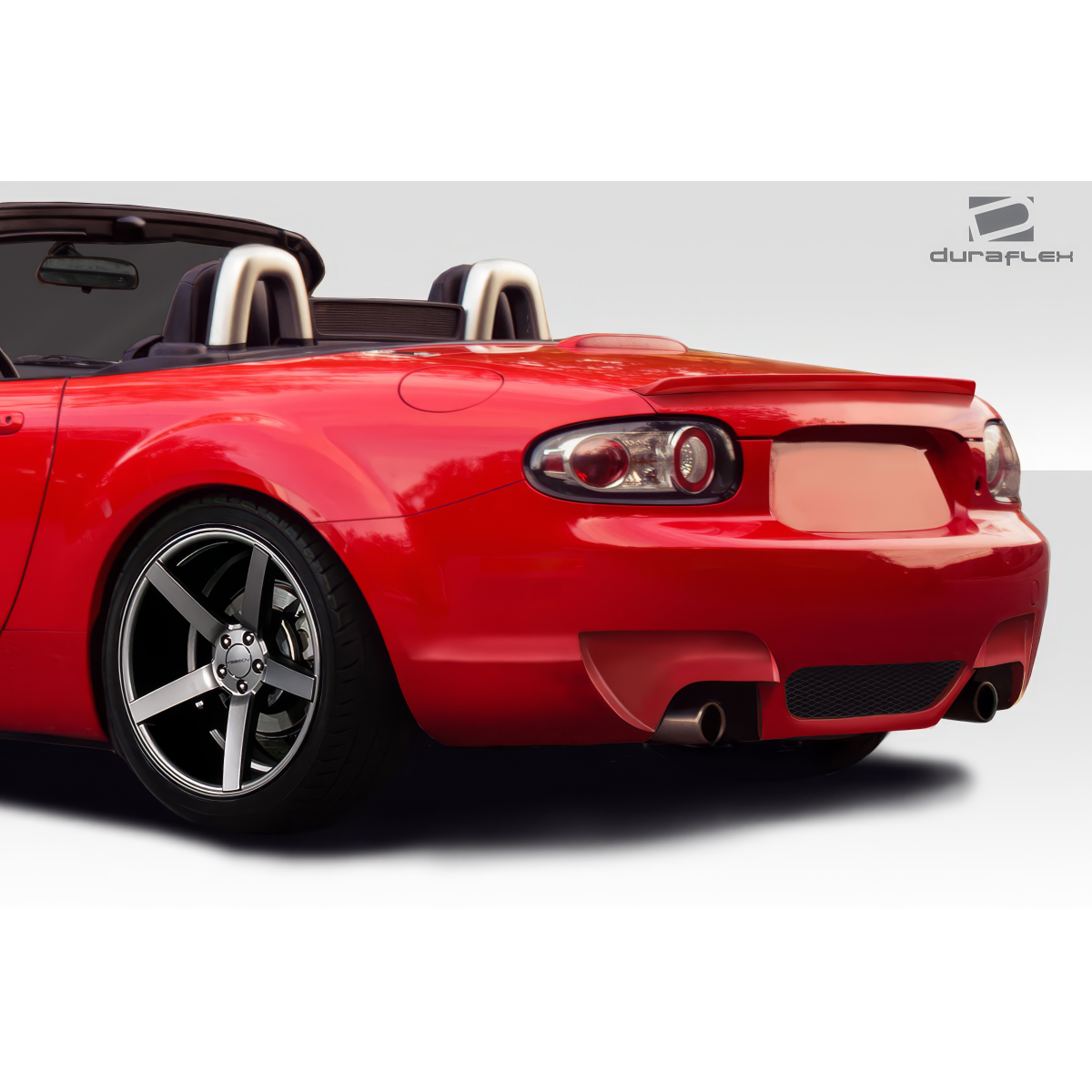 Modify your Mazda Miata 2006 with our Exterior/Rear Bumpers or Lips - Rear angle view of a red Mazda Miata