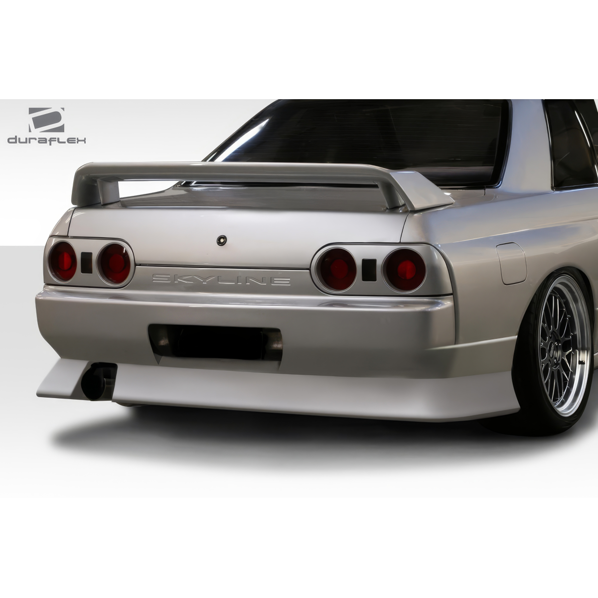 Modify your Nissan Skyline 1989 with our Exterior/Rear Bumpers or Lips - Viewed from slightly above and behind vehicle