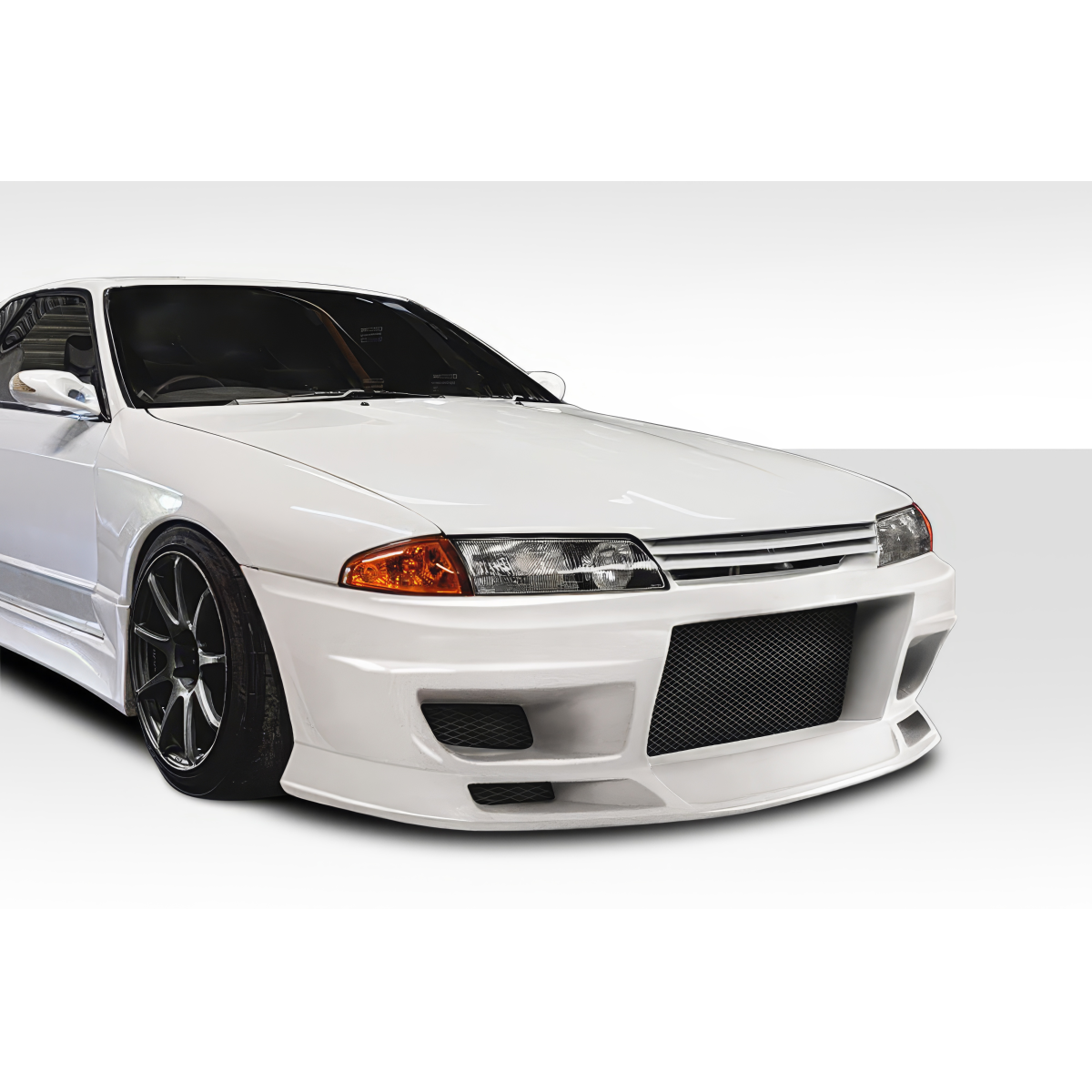 Modify your Nissan Skyline 1989 with our Exterior/Front Bumpers or Lips - Front angle view of a Nissan Skyline R32