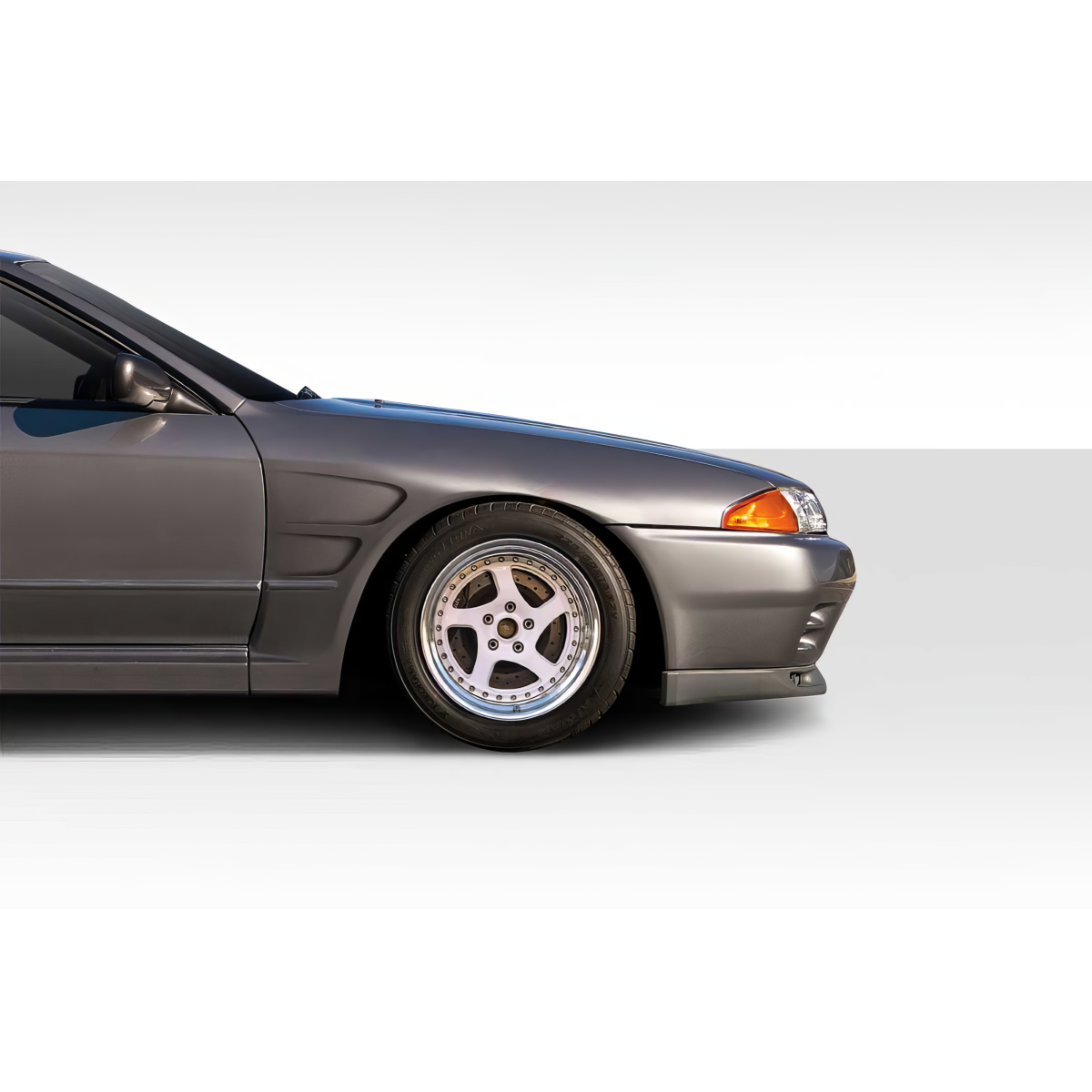 Modify your Nissan Skyline 1989 with our Exterior/Fenders - Side profile view of car at a slight angle