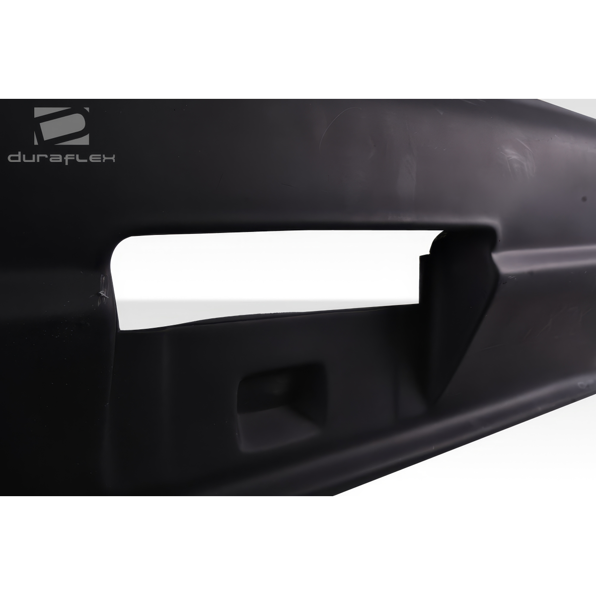 Modify your Nissan Skyline 1995 with our Exterior/Rear Bumpers or Lips - Angled view of rear bumper showing design details