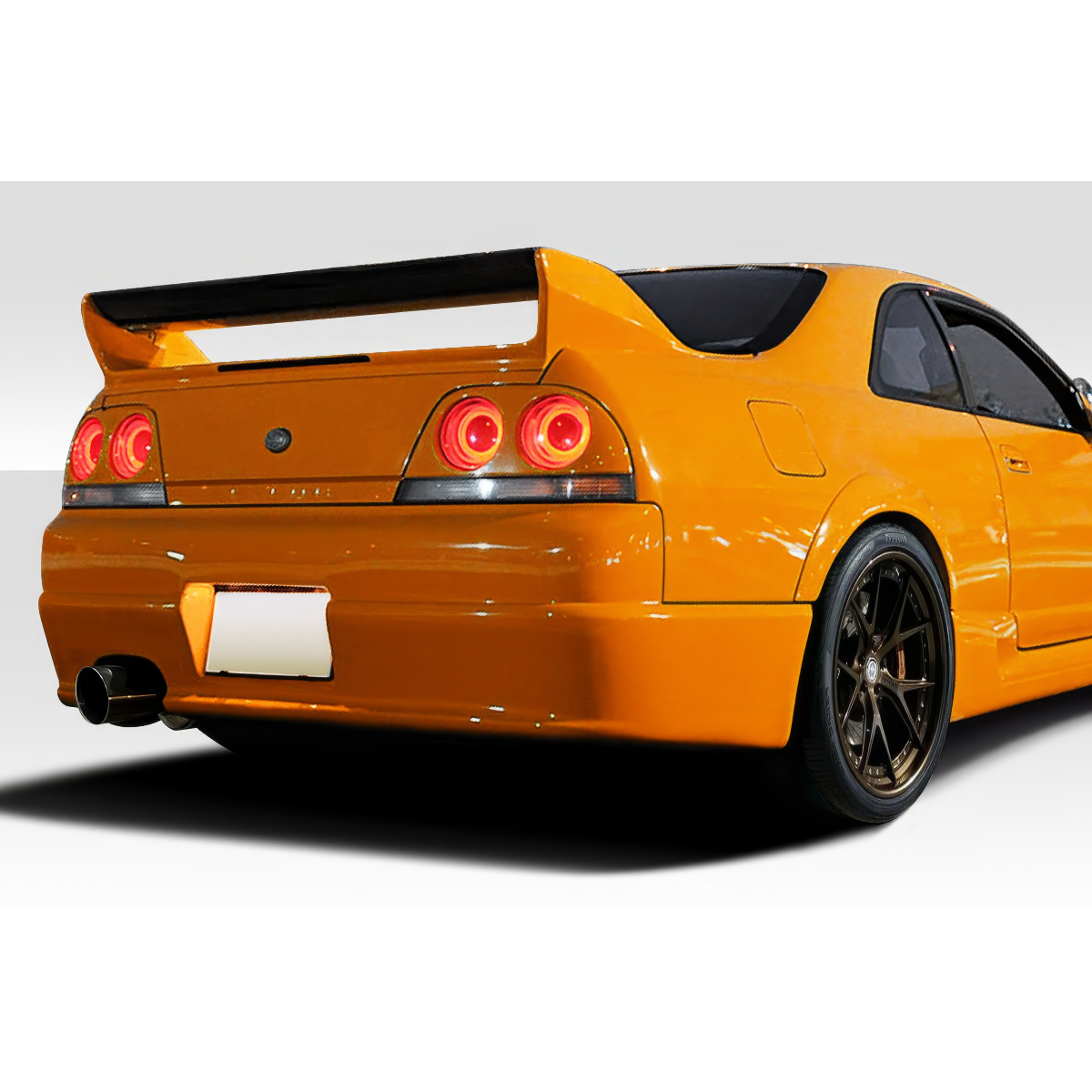 Modify your Nissan Skyline 1995 with our Exterior/Rear Bumpers or Lips - Viewed from the rear at a slight angle
