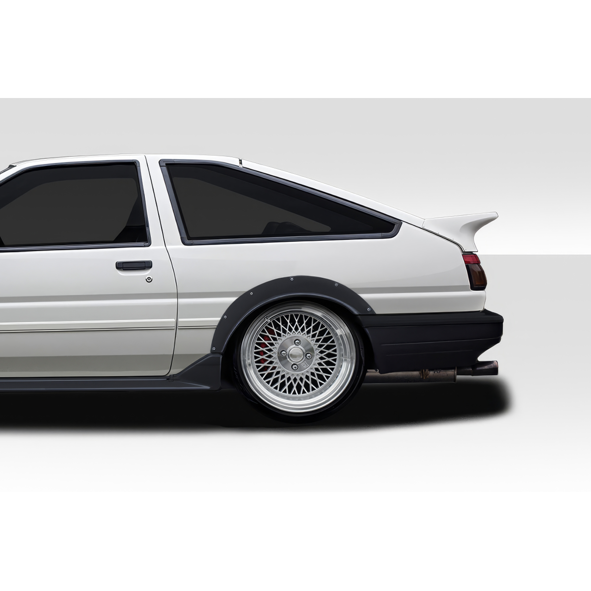 Modify your Toyota Corolla 1984 with our Exterior/Fenders - Side view showcasing wide body fender design