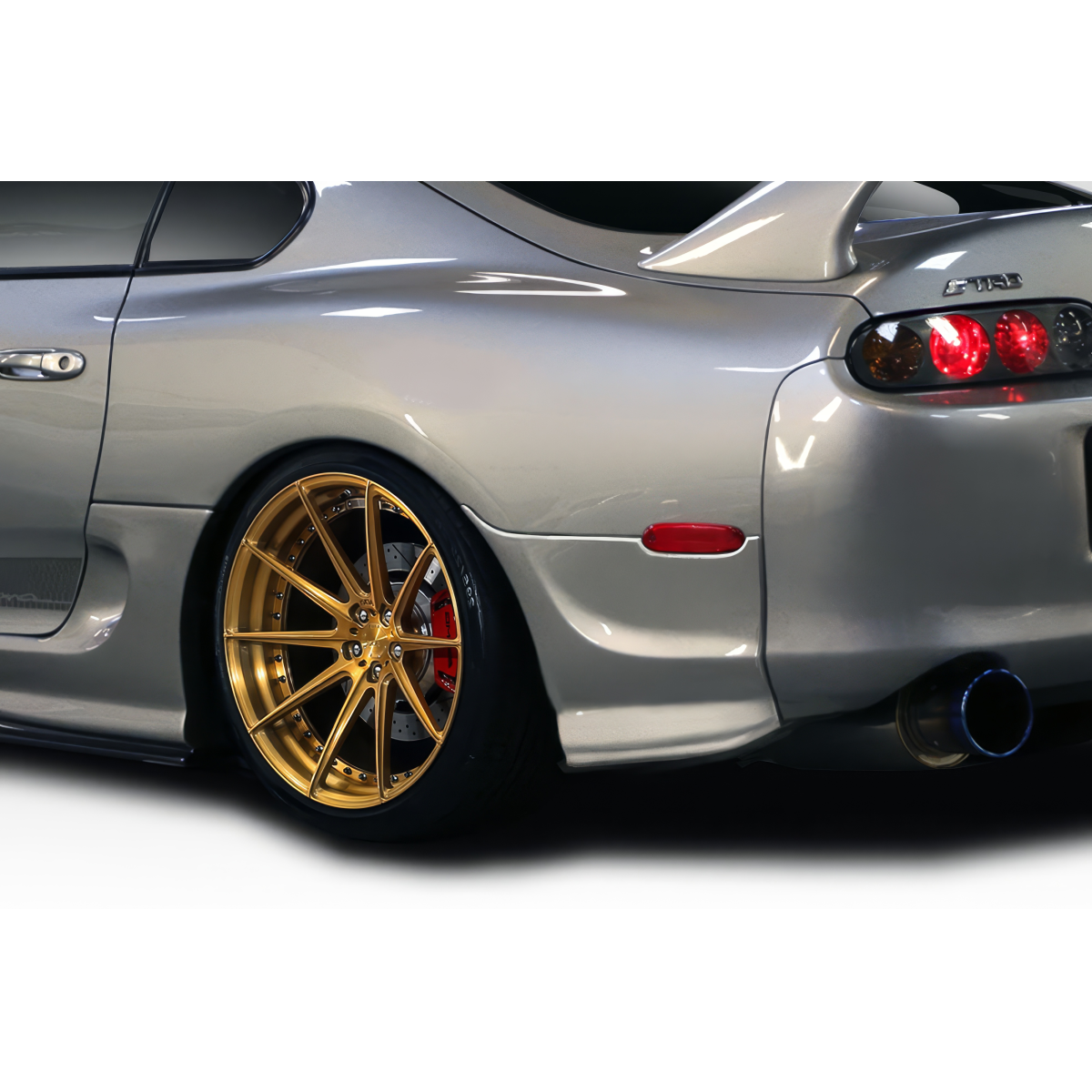 Modify your Toyota Supra 1993 with our Exterior/Rear Bumpers or Lips - Rear quarter angle view of the vehicle