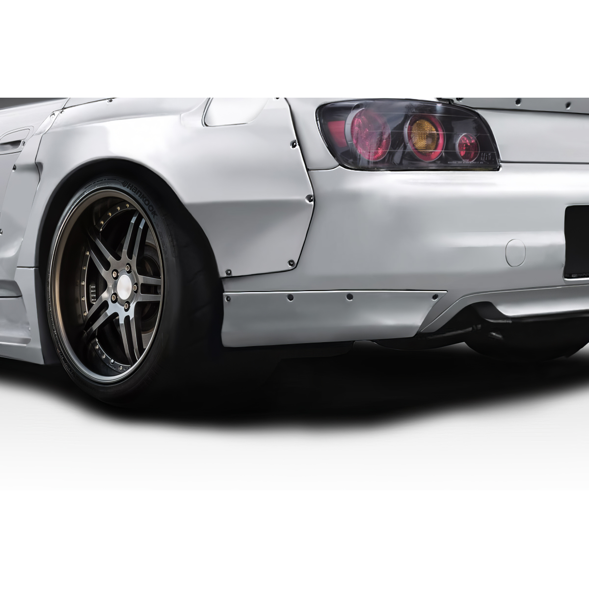 Modify your Honda S2000 2000 with our Exterior/Rear Bumpers or Lips - Rear view angle showing bumper and tire details