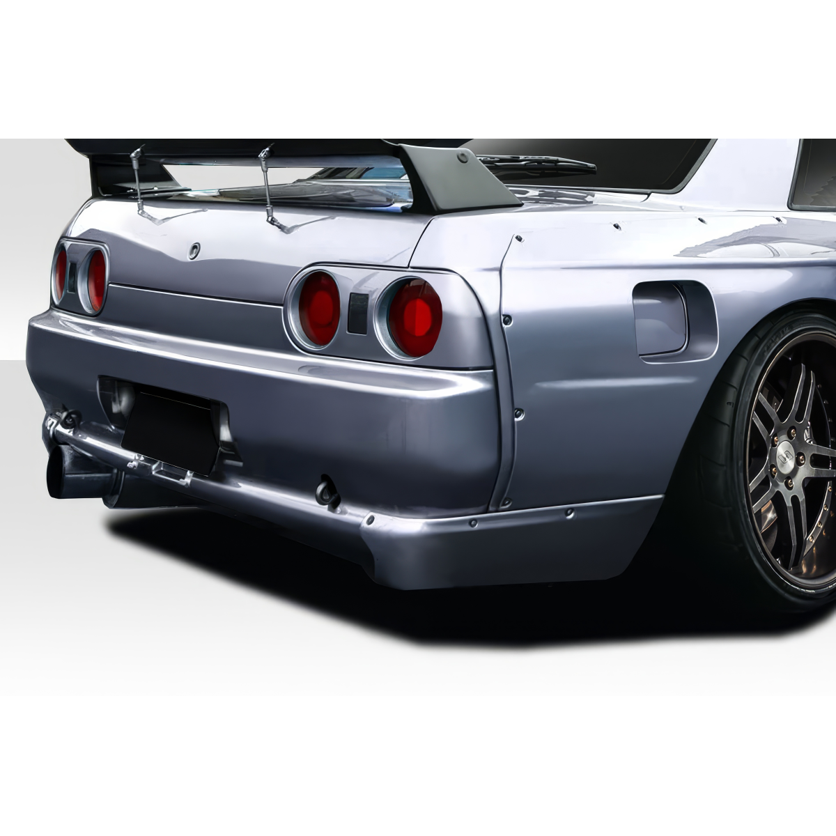 Modify your Nissan Skyline 1989 with our Exterior/Rear Bumpers or Lips - Rear angle view of Nissan Skyline R32