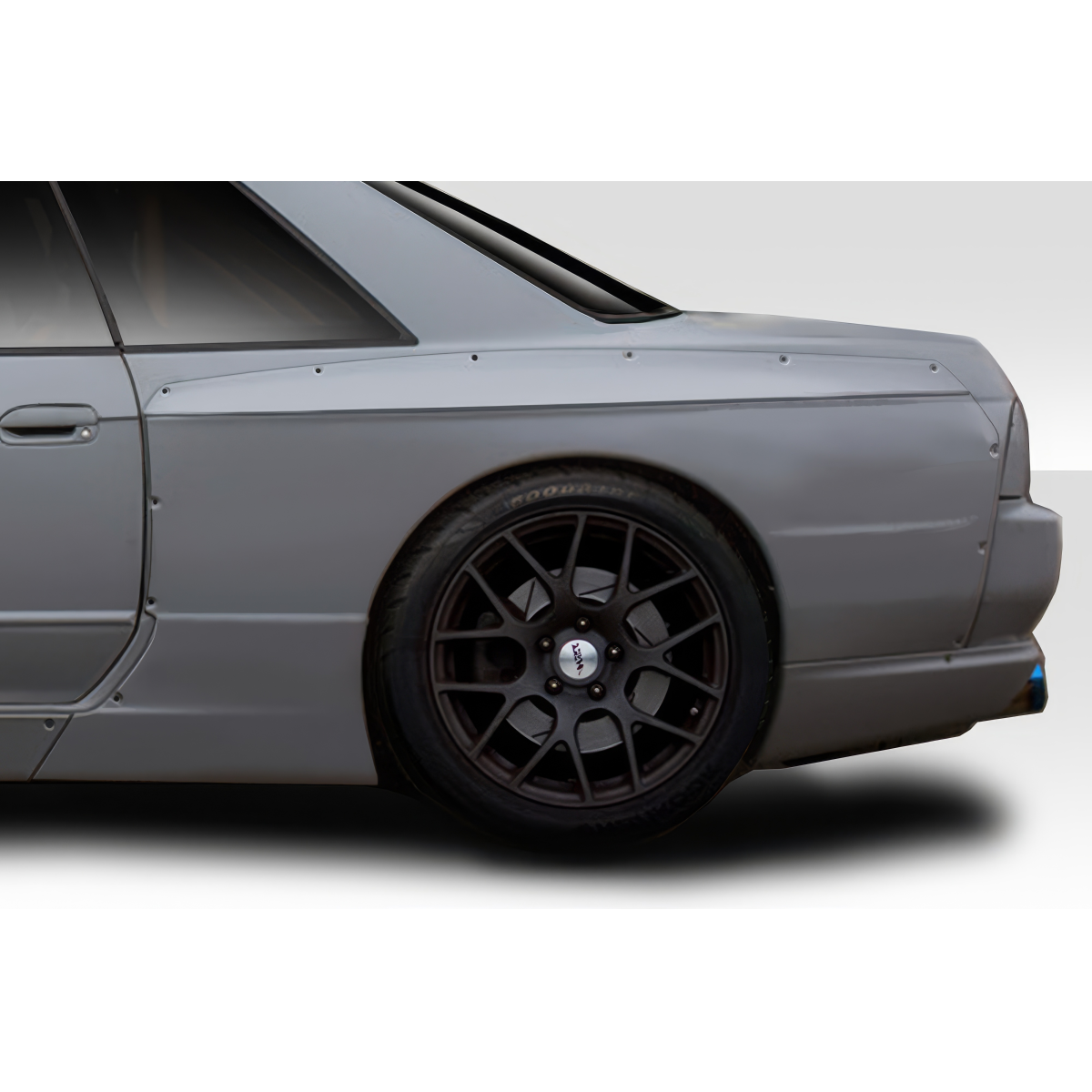 Modify your Nissan Skyline 1989 with our Exterior/Fenders - The part is viewed from a rear three quarter angle