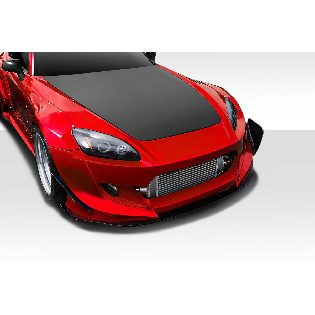 Modify your Honda S2000 2000 with our Exterior/Front Bumpers - Front angled view of car showcasing bumper design