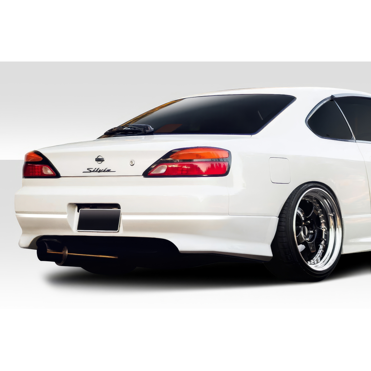 Modify your Nissan Silvia 1999 with our Exterior/Rear Bumpers or Lips - Rear angle of the vehicle showcasing rear bumper