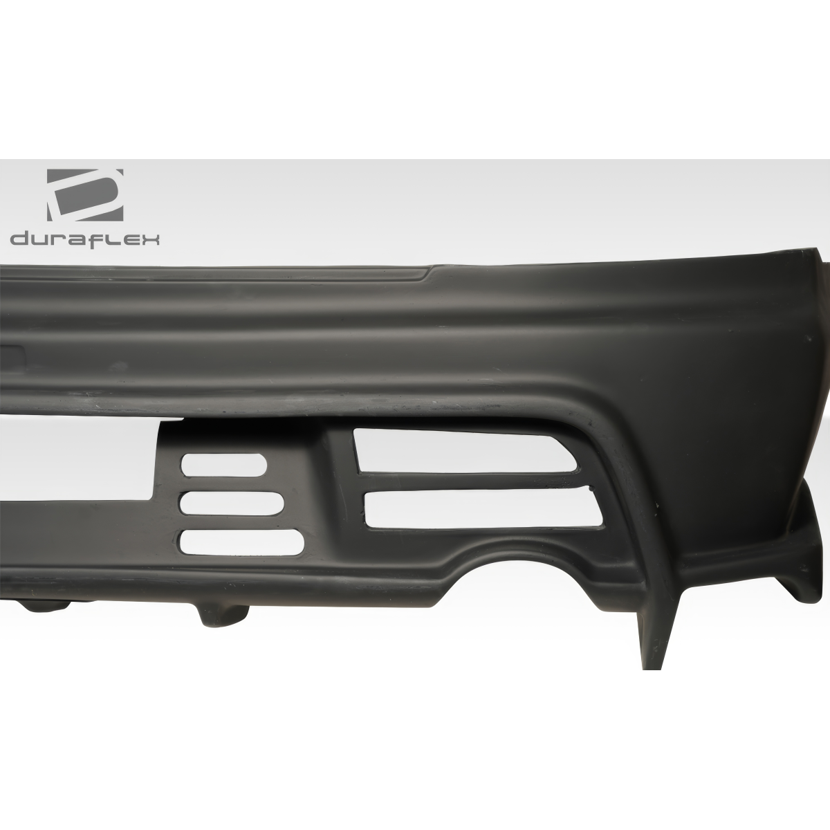 Modify your Mitsubishi Evolution 2003 with our Exterior/Rear Bumpers or Lips - Image shows rear bumper at a side angle