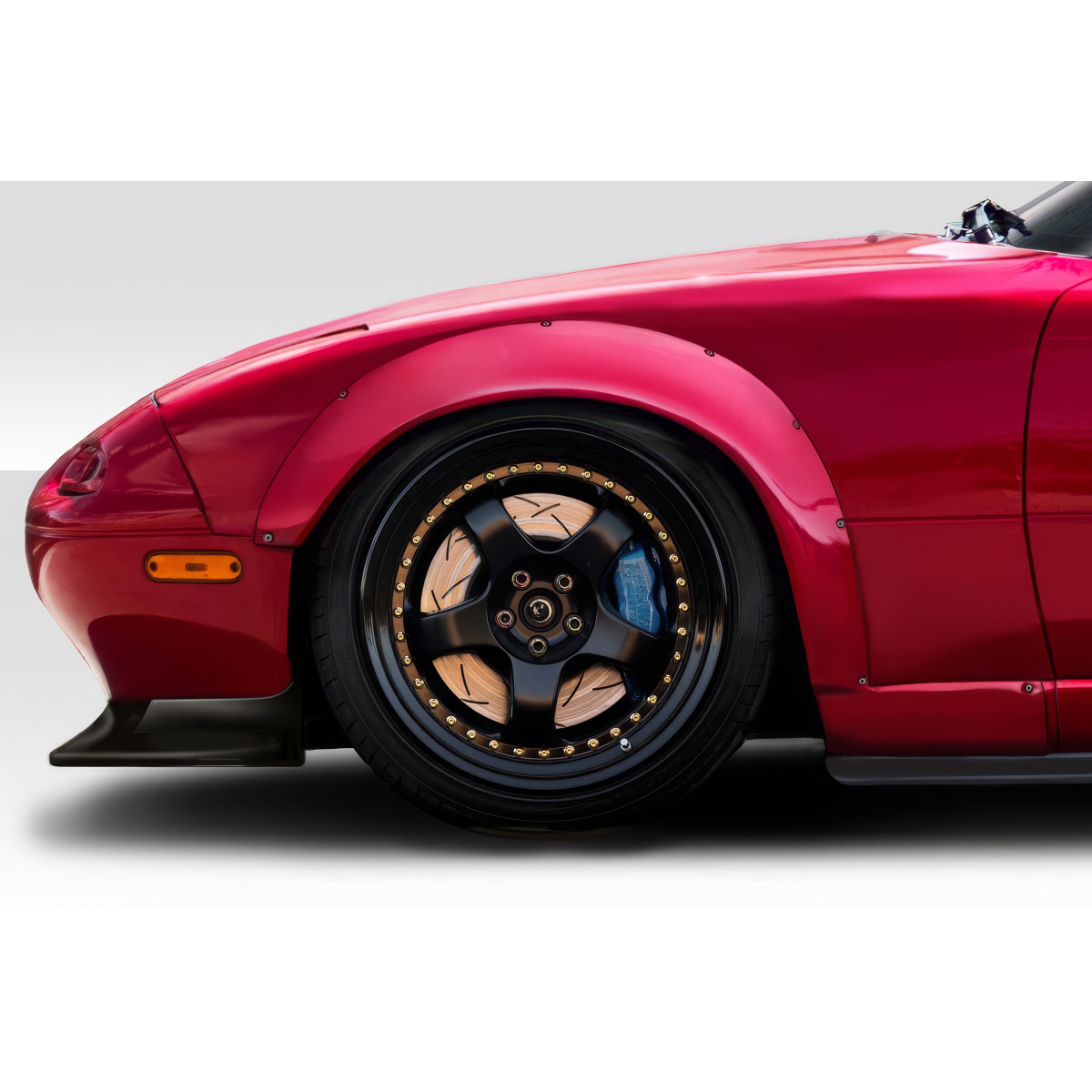 Modify your Mazda Miata 1990 with our Exterior/Fenders - Side view of fender and wheel at slight angle