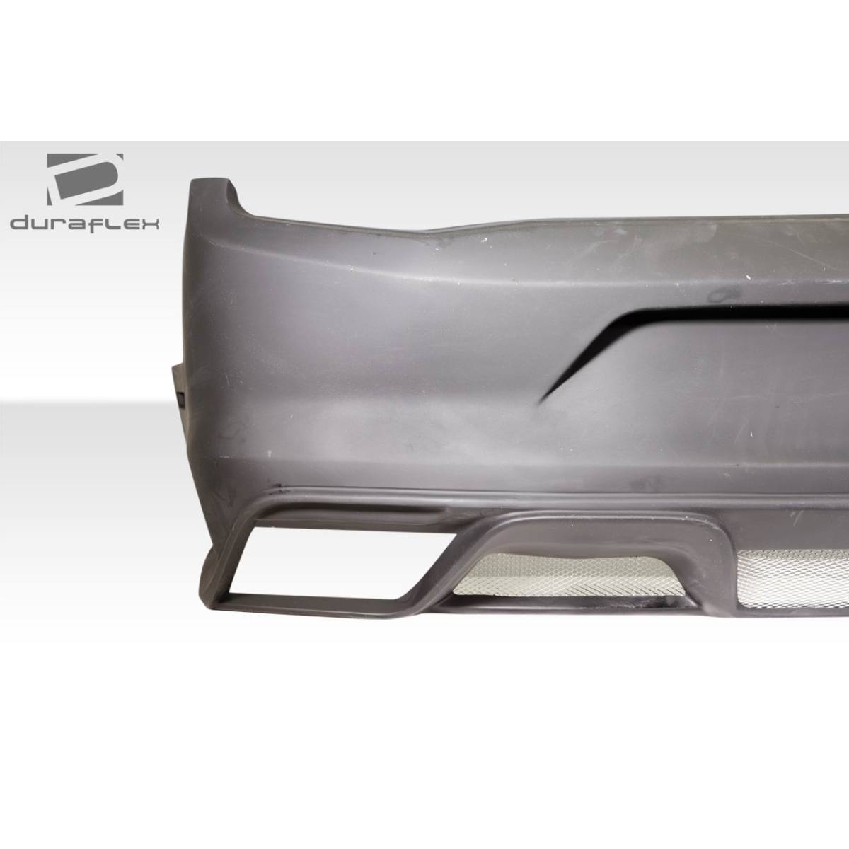 Modify your Ford Mustang 2010 with our Exterior/Rear Bumpers or Lips - Image shows rear bumper at a slight angle