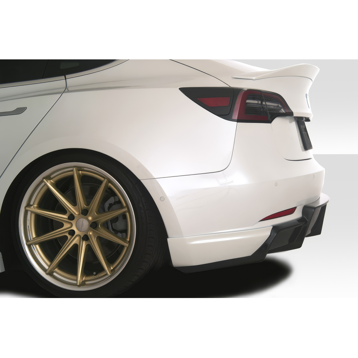 Modify your Tesla 3 2018 with our Exterior/Diffusers - The image shows a rear angle of the vehicle