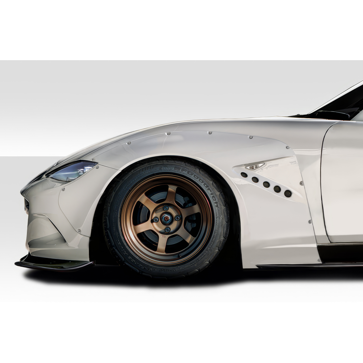 Modify your Mazda Miata 2016 with our Exterior/Fenders - Side angle view of car fender and wheel