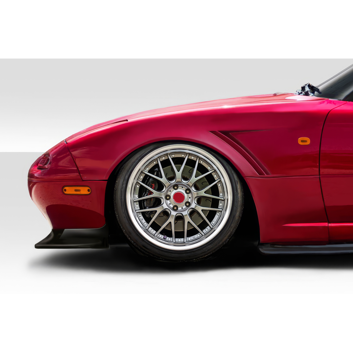 Modify your Mazda Miata 1990 with our Exterior/Fenders - Side angle showcasing fender and wheel details