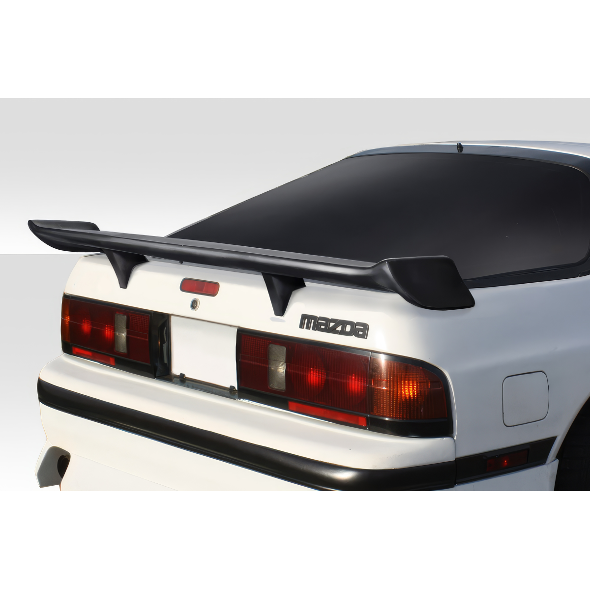 Modify your Mazda RX-7 1986 with our Exterior/Wings - Rear angle showing rear wing spoiler on vehicle