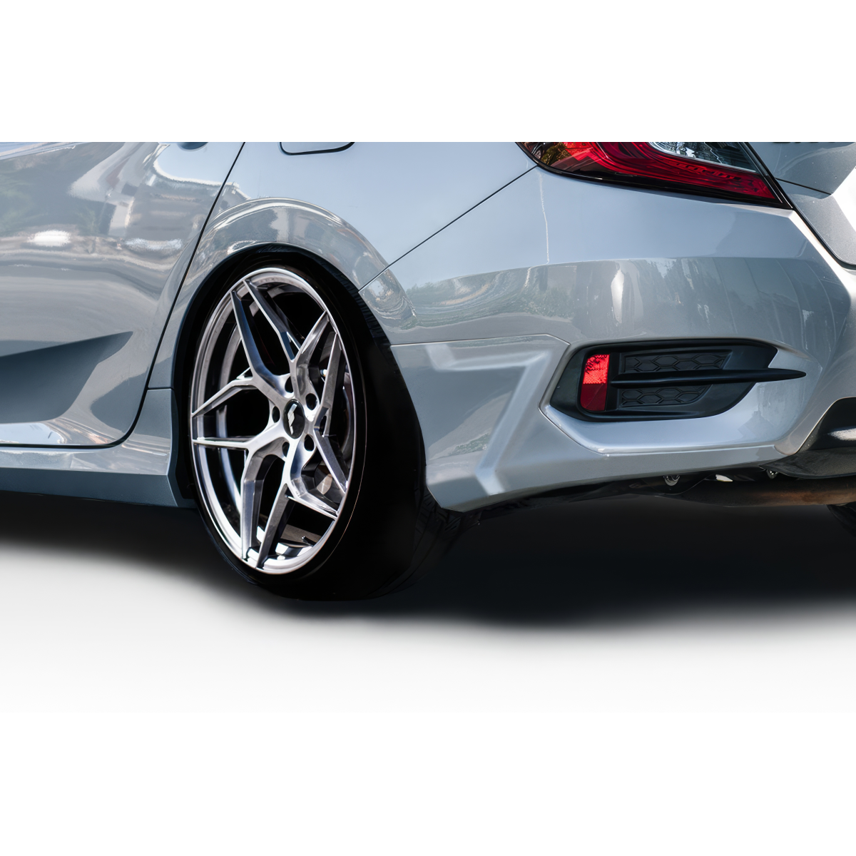 Modify your Honda Civic 2016 with our Exterior/Rear Lips - Rear angle view of the vehicle and the part
